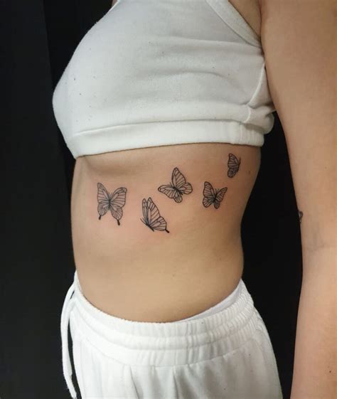 moth under breast tattoo|23 Under Breast Tattoo Ideas For The Bravest。